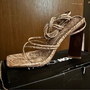 Nude, snake print, tie up block heel.